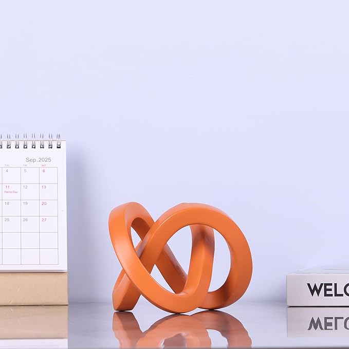 Orange knot decorative sculpture, orange home decor aesthetics, Möbius strip sculpture, suitable for decoration and display on bookshelves, living room TV cabinets, office cabinets, and coffee tables.